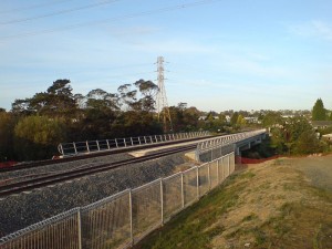 The rail line path will enter the former Waitakere along this bridge north of Olympic Park.