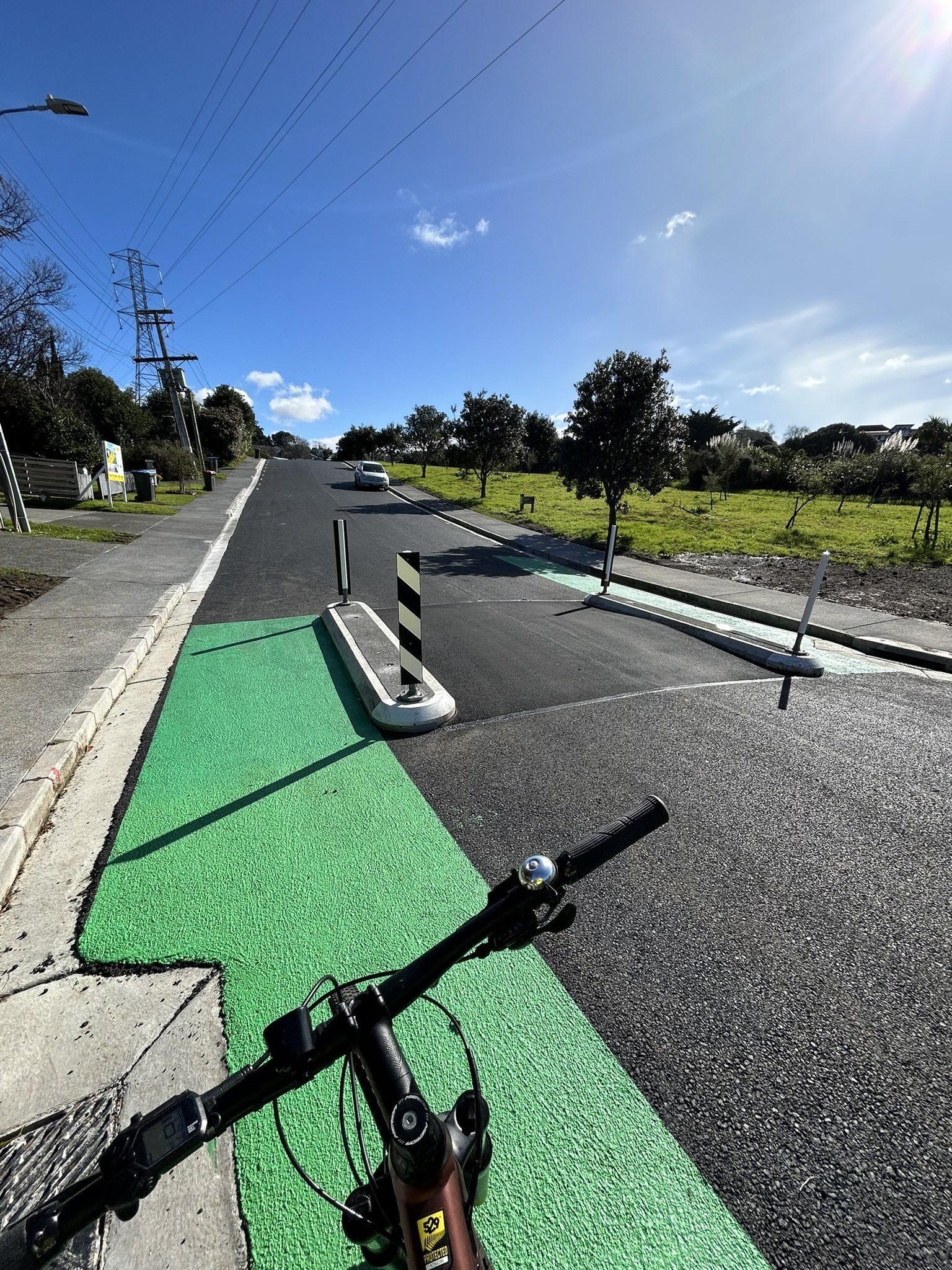 speed calming along a quiet but steep street. There are gaps either side of the speed table to allow people on bikes to continue along the roadway unimpeded.