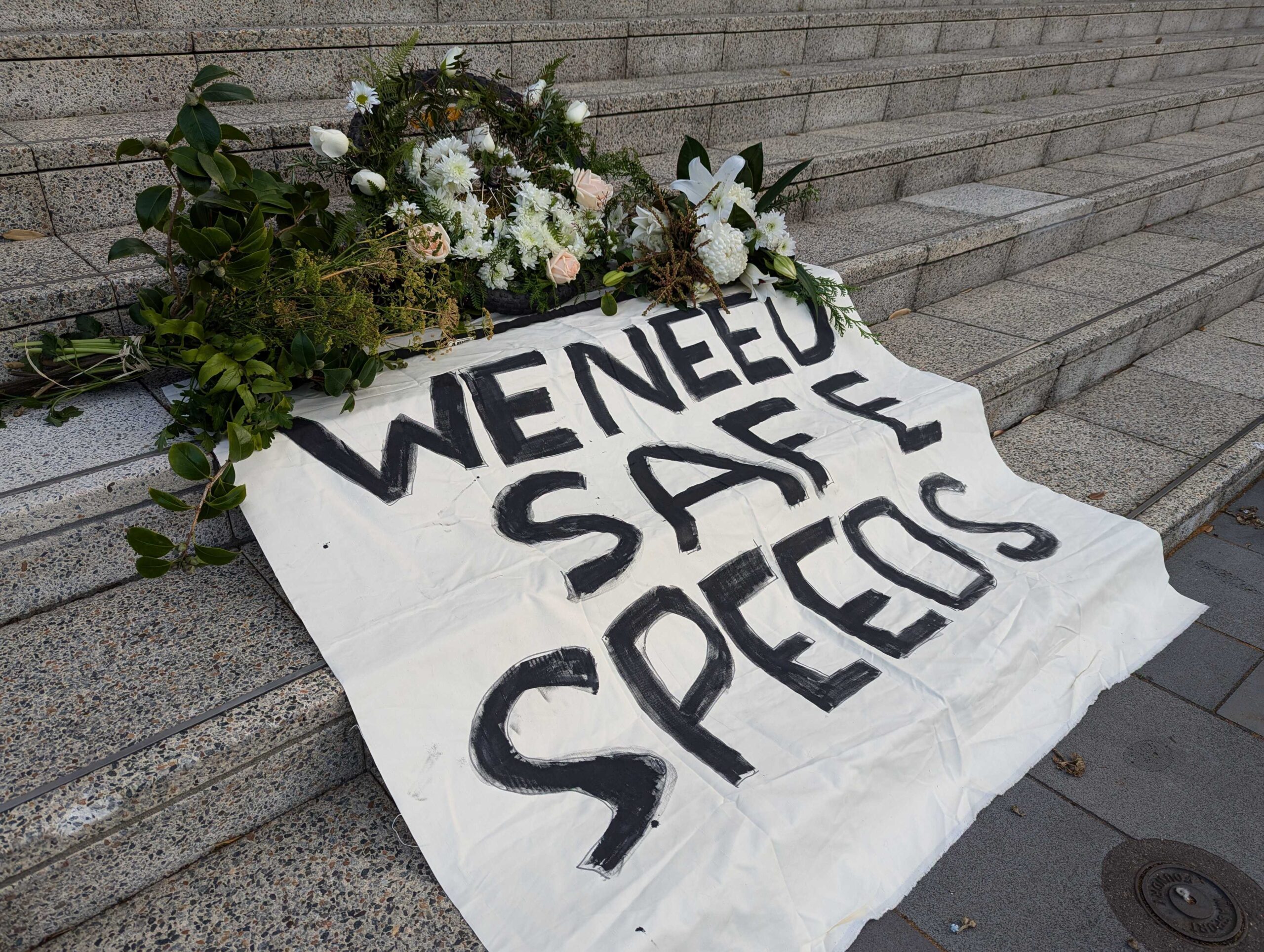 A wreath on steps with a sign "we need safe speeds"