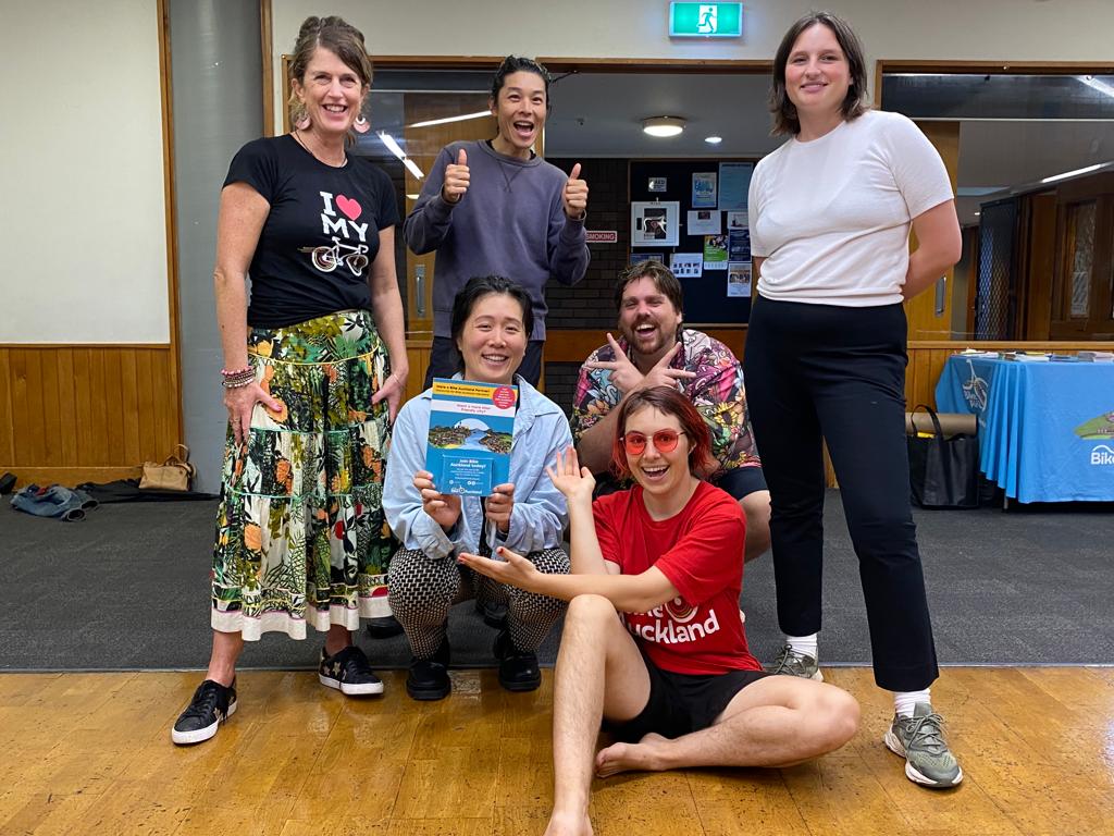 6 people pose for a photo, smiling