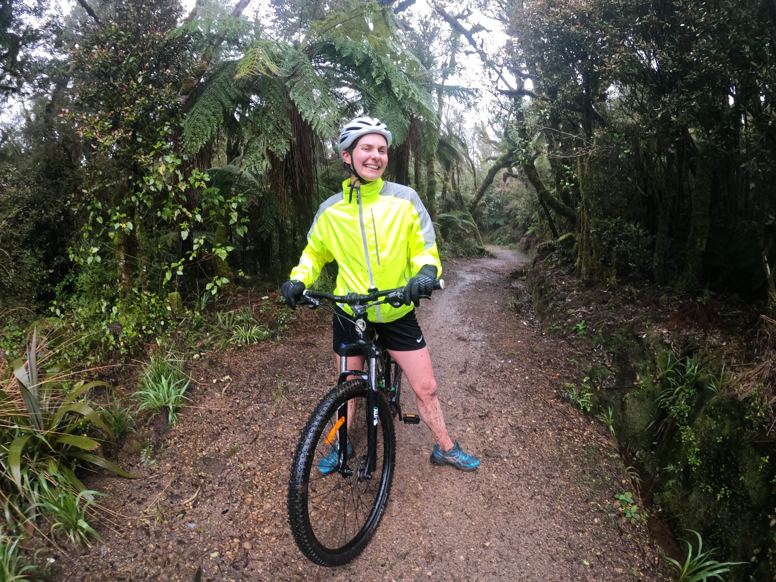 pakeha woman on mountain bike in forest