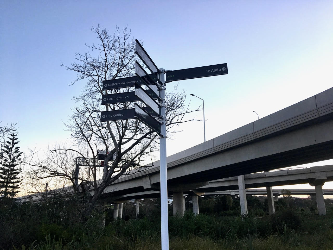 Signpost with lots of destinations for people on bikes